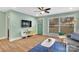 Living room with a modern aesthetic, featuring a teal door and large windows at 2027 Ibis Ct, Charlotte, NC 28205