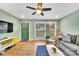 Relaxing living room with a gray couch and ample natural light at 2027 Ibis Ct, Charlotte, NC 28205