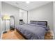 Spacious bedroom with a queen bed and a built-in workspace at 203 Grandin Rd # 3, Charlotte, NC 28208