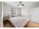 Bright bedroom featuring a queen bed, nightstand, and hardwood floors at 203 Grandin Rd # 3, Charlotte, NC 28208