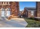 Brick building with a side entrance and landscaping at 203 Grandin Rd # 3, Charlotte, NC 28208