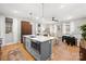 Open concept kitchen with large island and stainless steel appliances at 203 Grandin Rd # 3, Charlotte, NC 28208