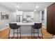 Modern kitchen with white cabinets, quartz counters, and island at 203 Grandin Rd # 3, Charlotte, NC 28208