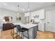 Sleek kitchen island with white cabinets and stainless steel appliances at 203 Grandin Rd # 3, Charlotte, NC 28208