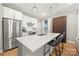 Modern kitchen with stainless steel appliances and large island at 203 Grandin Rd # 3, Charlotte, NC 28208