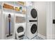 Well-appointed laundry room with washer, dryer, and ample storage at 203 Grandin Rd # 3, Charlotte, NC 28208