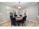 Bright dining room with hardwood floors and seating for six at 2101 Darian Way, Waxhaw, NC 28173