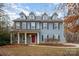 Two-story house with gray siding, red door, and landscaping at 2101 Darian Way, Waxhaw, NC 28173