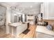 Modern kitchen with white cabinets, quartz counters, and island at 2101 Darian Way, Waxhaw, NC 28173