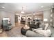 Open living room with view into kitchen and casual seating at 2101 Darian Way, Waxhaw, NC 28173