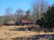 Distressed barn with rusty roof in field at 211 Forgotten Ln, Bessemer City, NC 28016