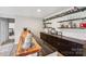 Basement bar with wooden countertop and ample shelving at 2178 Grist Mill Dr, Concord, NC 28025