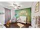 bedroom with crib and green accent wall at 2178 Grist Mill Dr, Concord, NC 28025