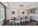 Farmhouse style dining room with long wooden table and statement wall at 2178 Grist Mill Dr, Concord, NC 28025