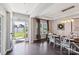 Bright dining room featuring a rustic wood table and white chairs at 2178 Grist Mill Dr, Concord, NC 28025