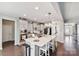 Modern kitchen with white cabinets, large island, and stainless steel appliances at 2178 Grist Mill Dr, Concord, NC 28025