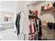 Well-organized walk-in closet with shelving and hanging rods at 2178 Grist Mill Dr, Concord, NC 28025