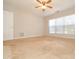 Spacious bedroom with window, ceiling fan, and neutral decor at 247 Aylesbury Ln, Indian Trail, NC 28079