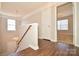 Upstairs hallway with wood-look flooring and access to bedrooms at 247 Aylesbury Ln, Indian Trail, NC 28079