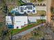 Aerial view of a modern home with a pool, solar panels, and meticulously landscaped grounds at 2832 Arcadia Ave, Charlotte, NC 28209