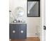 Stylish powder room featuring a floating vanity, round mirror, and modern fixtures at 2832 Arcadia Ave, Charlotte, NC 28209