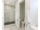 Modern bathroom with a glass-enclosed shower featuring patterned tile and sleek fixtures at 2832 Arcadia Ave, Charlotte, NC 28209