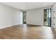 This light-filled bedroom has hardwood floors and large windows with views at 2832 Arcadia Ave, Charlotte, NC 28209