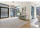 Bright foyer with hardwood floors, modern lighting, and large windows creating a light-filled space at 2832 Arcadia Ave, Charlotte, NC 28209