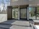 Covered front entrance featuring a black privacy door, modern design and glass accents at 2832 Arcadia Ave, Charlotte, NC 28209