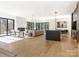 Spacious living room features hardwood floors, a modern fireplace, and large windows at 2832 Arcadia Ave, Charlotte, NC 28209