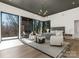 Bright main bedroom featuring floor-to-ceiling windows, elegant decor, and a modern light fixture at 2832 Arcadia Ave, Charlotte, NC 28209