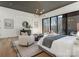 Comfortable main bedroom with neutral tones, a seating area, and expansive views through large windows at 2832 Arcadia Ave, Charlotte, NC 28209