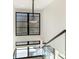 Bright staircase with modern railing and a large window offering a lot of natural light at 2832 Arcadia Ave, Charlotte, NC 28209