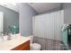 Clean bathroom with shower/tub combo and updated vanity at 3111 Hendricks Chapel Ln, Charlotte, NC 28216