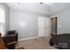 Bedroom with built-in desk and double door closet at 3111 Hendricks Chapel Ln, Charlotte, NC 28216