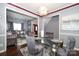 Open concept dining area with grey chairs and a glass-top table at 3111 Hendricks Chapel Ln, Charlotte, NC 28216