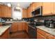 Kitchen with granite countertops and stainless steel appliances at 3111 Hendricks Chapel Ln, Charlotte, NC 28216