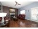 Living room featuring hardwood floors, fireplace, and leather furniture at 3111 Hendricks Chapel Ln, Charlotte, NC 28216