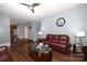 Open living room with hardwood floors and view into kitchen at 3111 Hendricks Chapel Ln, Charlotte, NC 28216