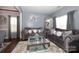 Living room boasts two grey sofas and a glass coffee table at 3111 Hendricks Chapel Ln, Charlotte, NC 28216