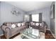 Living room with plush sofas, a coffee table, and a large mirror at 3111 Hendricks Chapel Ln, Charlotte, NC 28216