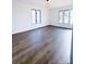 Spacious bedroom with hardwood floors and large windows at 318 S Rhyne St, Dallas, NC 28034