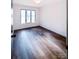 Bright bedroom with hardwood floors and large windows at 318 S Rhyne St, Dallas, NC 28034