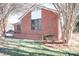 Brick home with landscaping and large windows at 318 S Rhyne St, Dallas, NC 28034