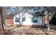 Side of house with white siding, brick accents, and windows at 318 S Rhyne St, Dallas, NC 28034