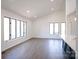 Bright living room featuring hardwood floors and abundant natural light at 318 S Rhyne St, Dallas, NC 28034