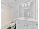 Clean bathroom with white vanity, tub, and mirror at 3264 Margellina Dr, Charlotte, NC 28210