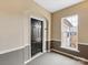 Apartment entryway with dark door and window at 3264 Margellina Dr, Charlotte, NC 28210