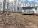 Expansive backyard with a deck, swing set, and wooden fence perfect for outdoor activities at 3605 Truxton Ct, Waxhaw, NC 28173