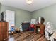 Cozy bedroom with hardwood floors and a window at 3605 Truxton Ct, Waxhaw, NC 28173